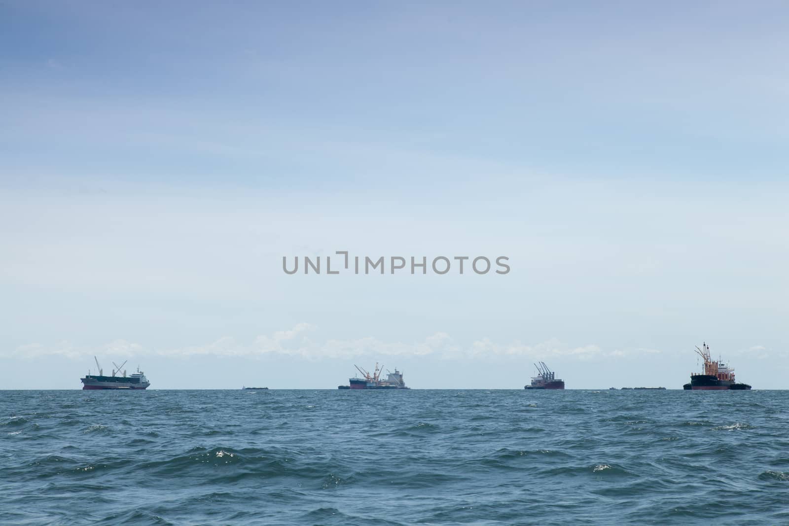 large cargo ship. Moored offshore. Transport near the docks.