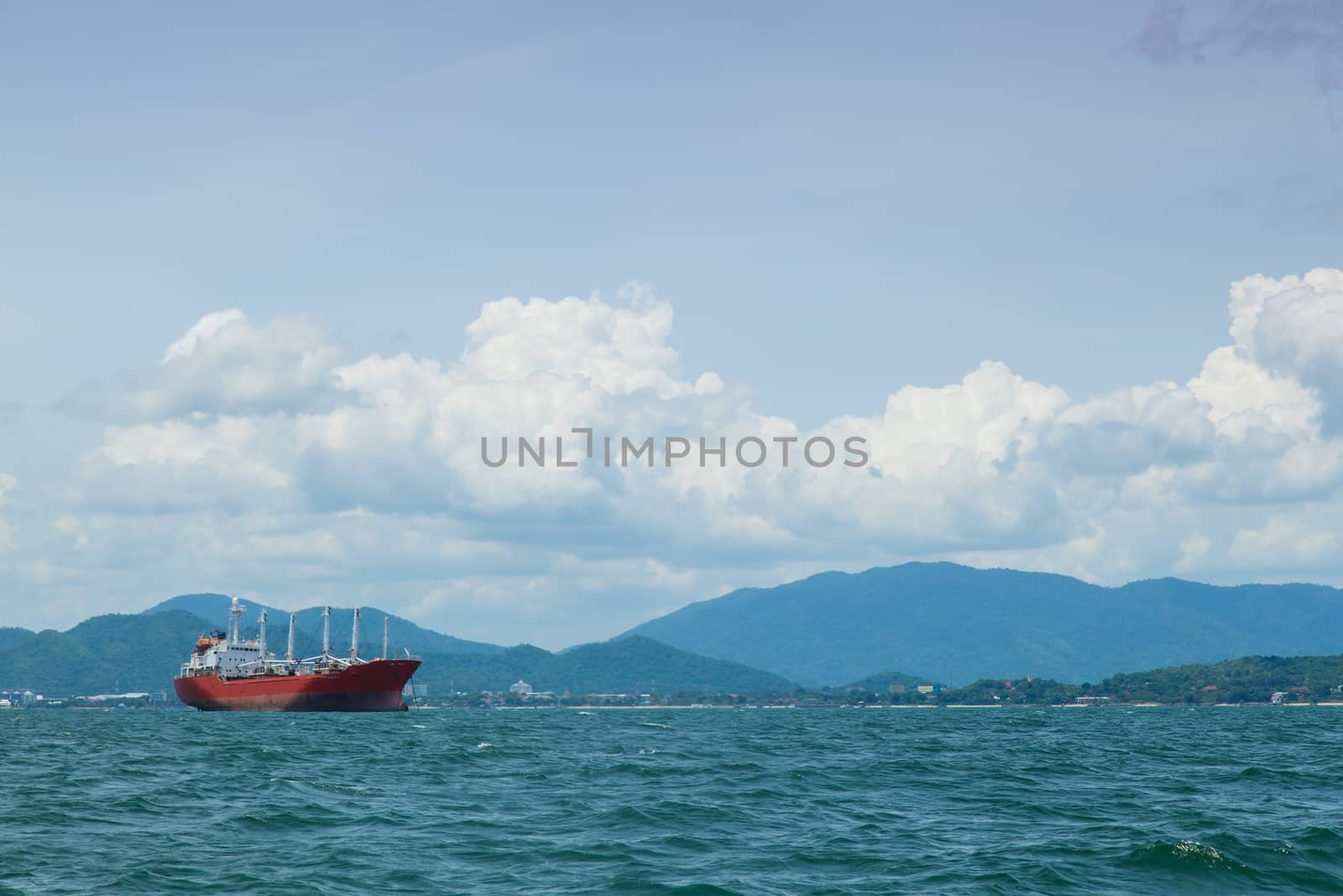 large cargo ship. Moored offshore. Transport near the docks.