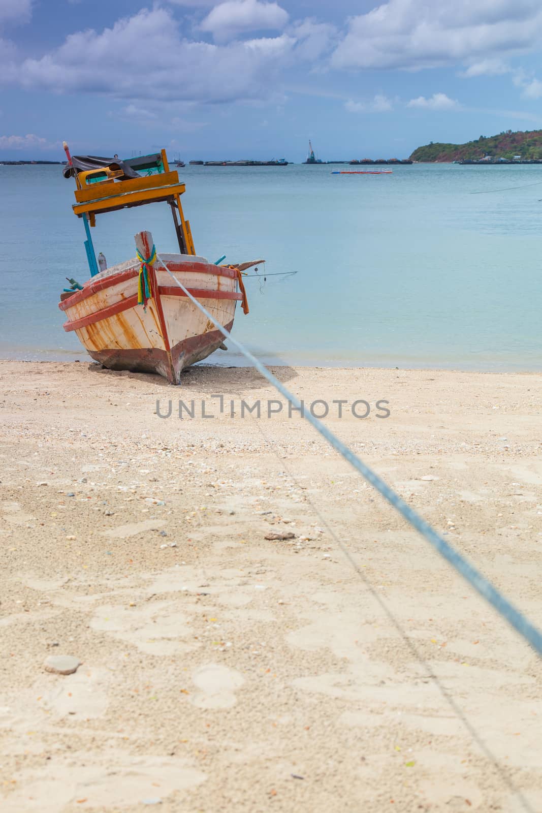 Small fishing boat. Parked on the beach. Ships were made of wood.