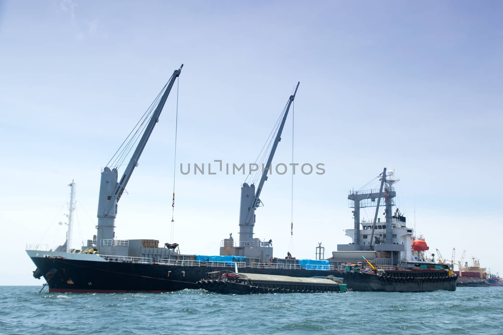 large cargo ship. Moored offshore. Transport near the docks.