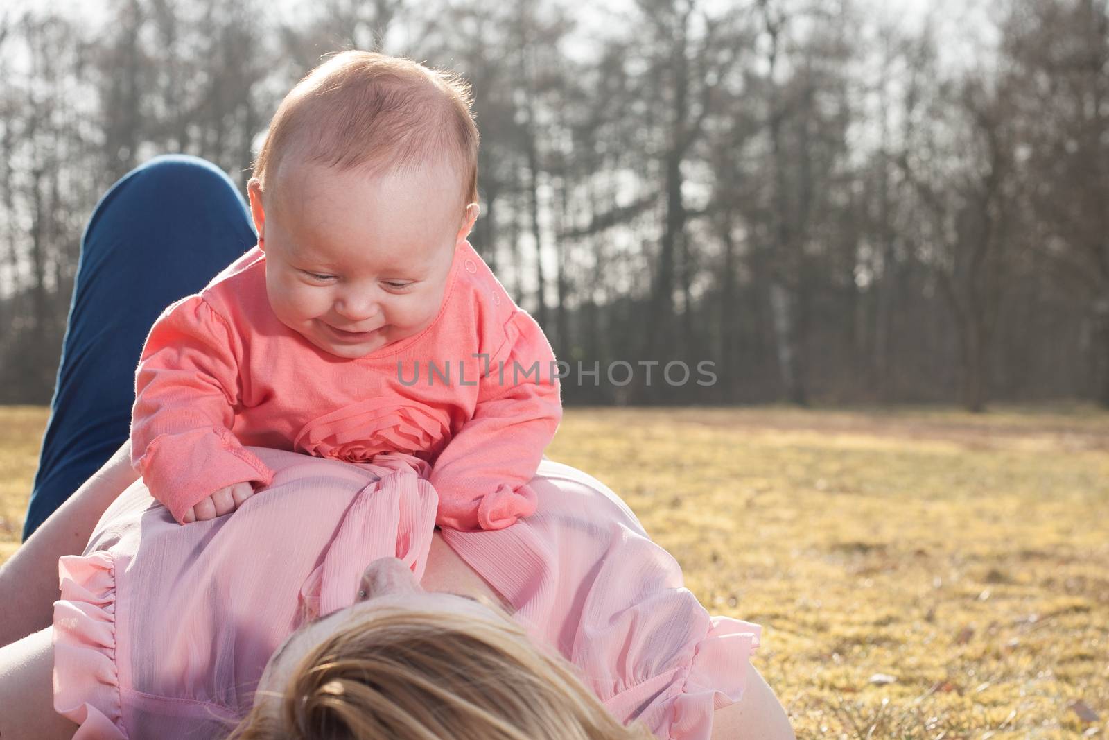 Mother and daughter on a sunny day in the field