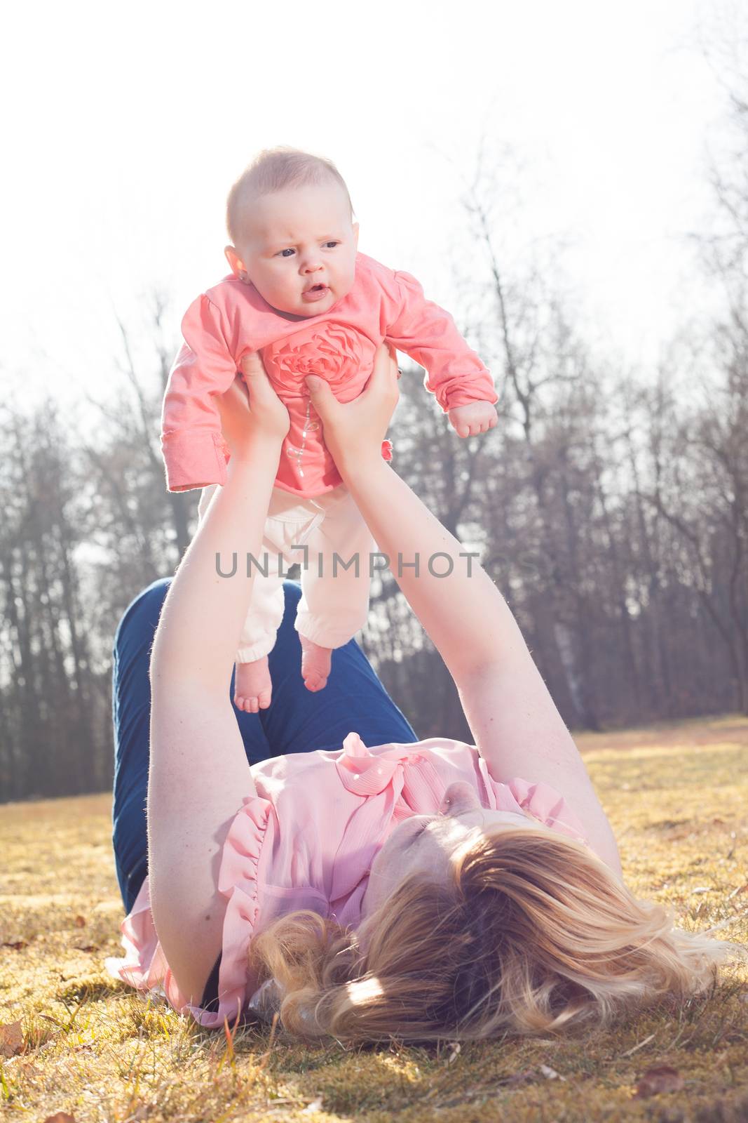 Mother is holding up her baby by DNFStyle