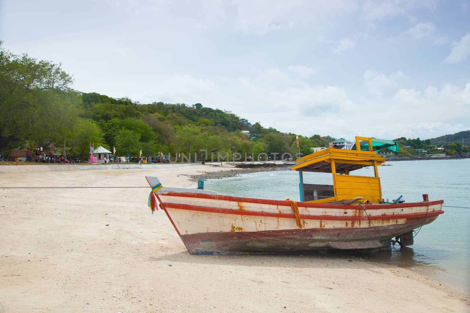 Small fishing boat. Parked on the beach. Ships were made of wood.