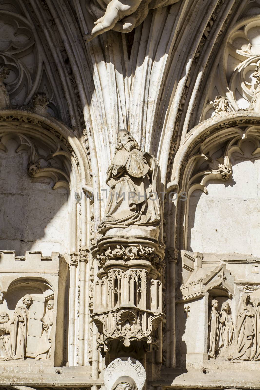 arch with figures of Gothic style cathedral in Toledo Spain by FernandoCortes