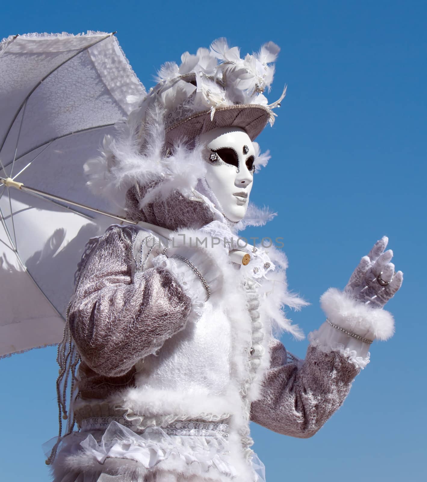White person with umbrella at the 2014 venetian carnival of Annecy, France
