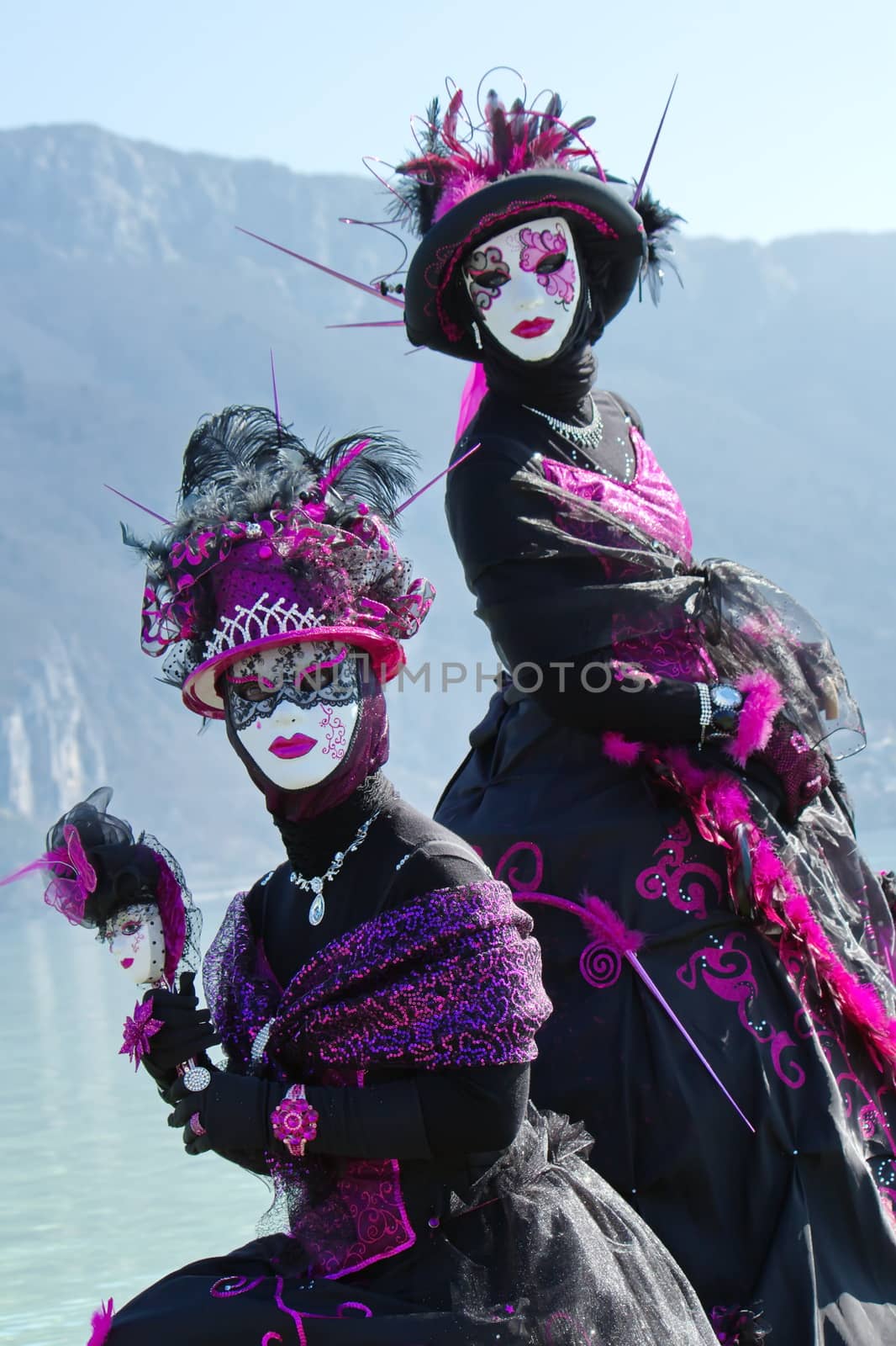 Colorful female couple at the 2014 venetian carnival of Annecy, France