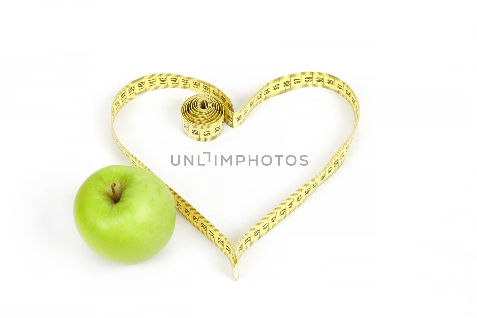 green apple with a measuring tape and heart symbol isolated on white background 