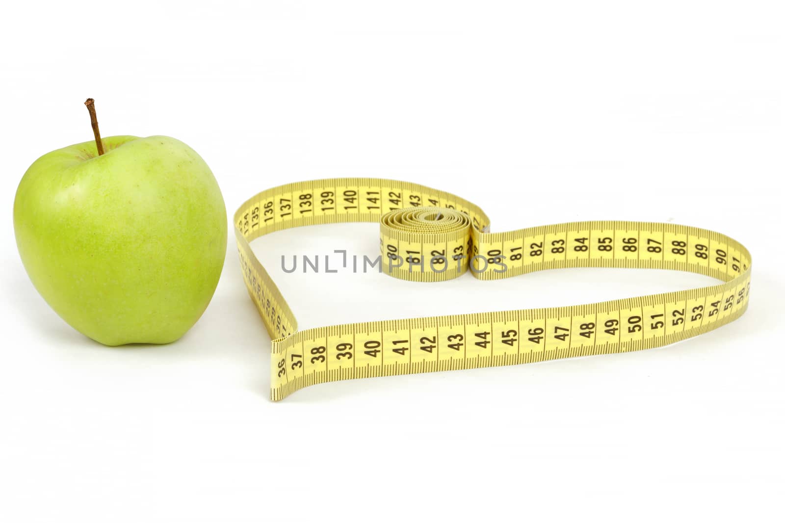 green apple with a measuring tape and heart symbol isolated on white background 