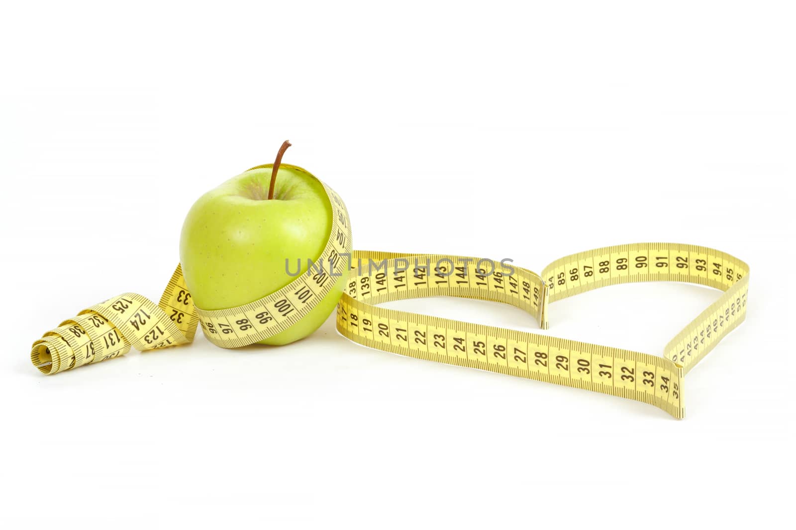 green apple with a measuring tape and heart symbol isolated on white background 