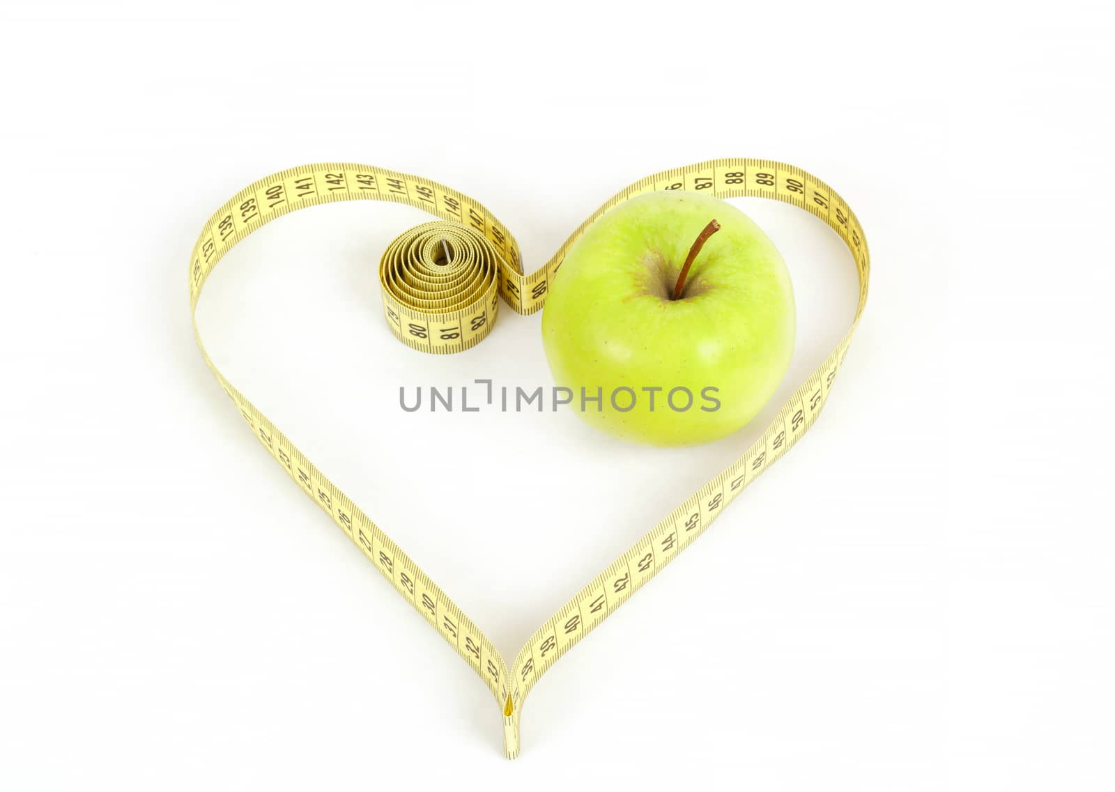 green apple with a measuring tape and heart symbol isolated on white background 