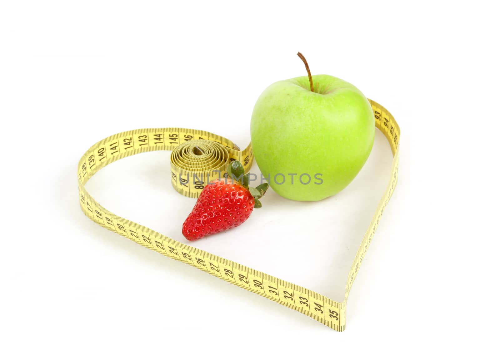 green apple and strawberry with a measuring tape and heart symbol isolated on white background 