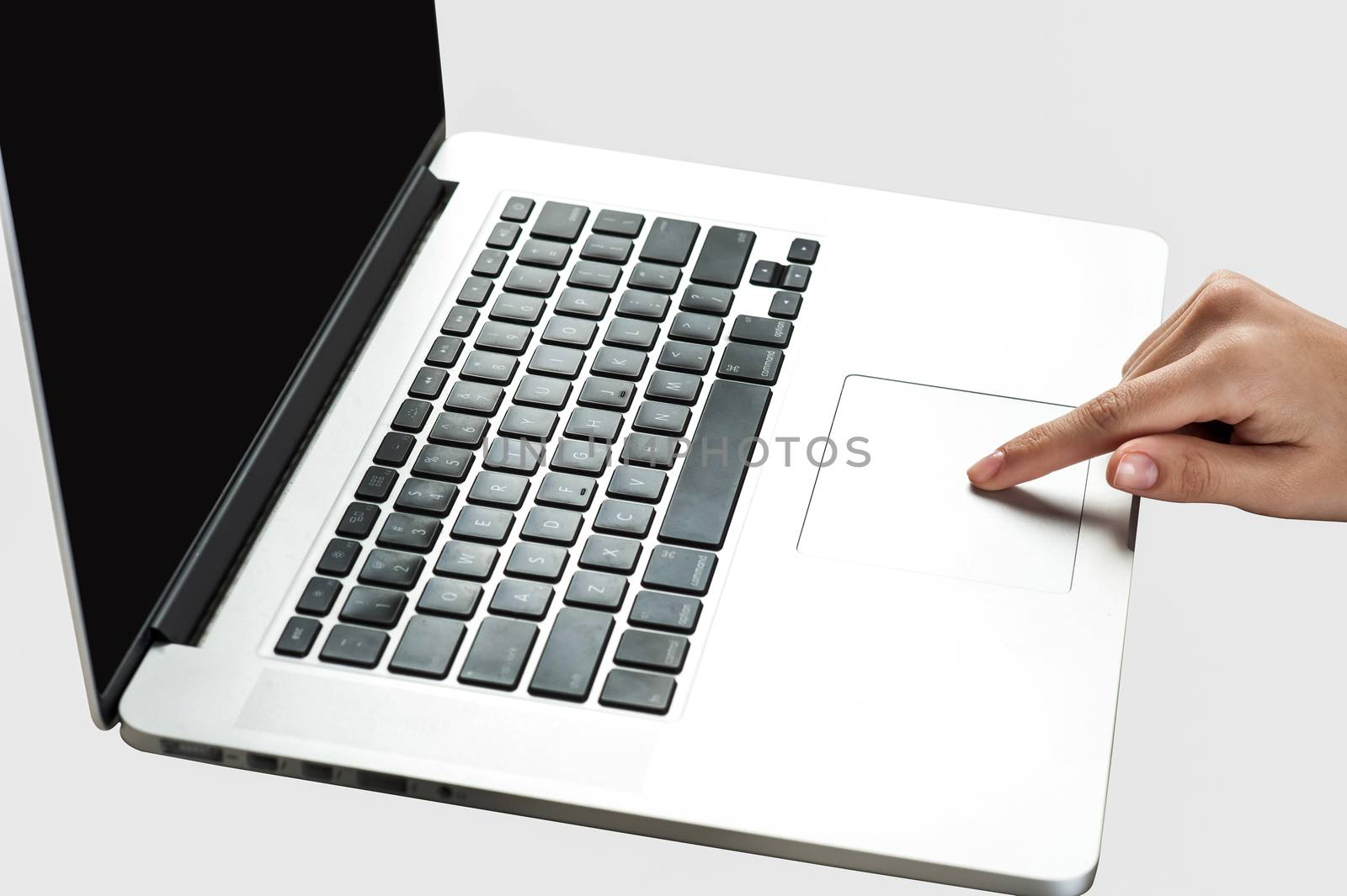 Woman hand using laptop by stockyimages