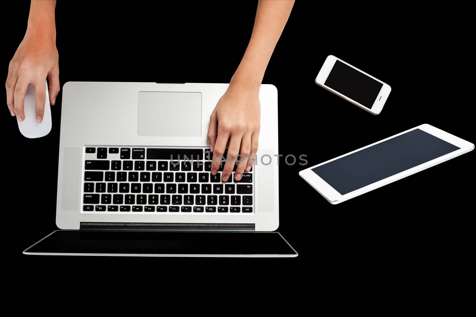 Open laptop with digital tablet and white smartphone