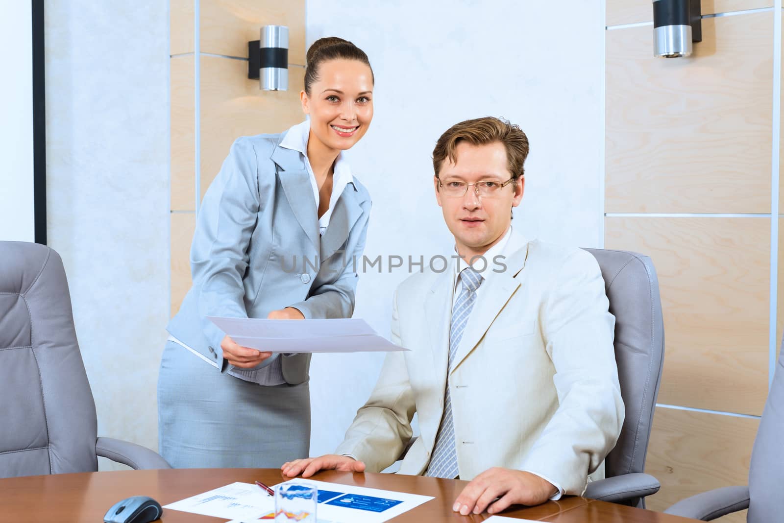 image of a two businessmen discussing documents, teamwork