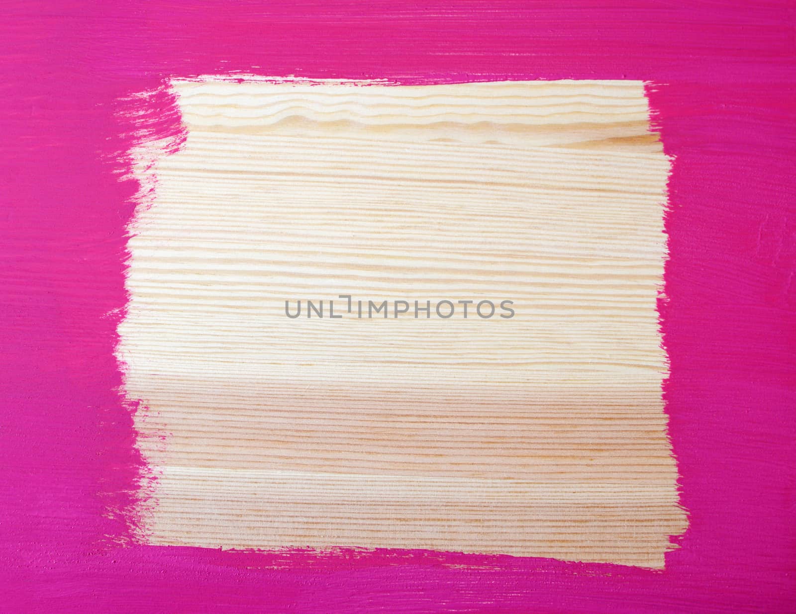 Roughly painted border on wooden background with copy space in the centre