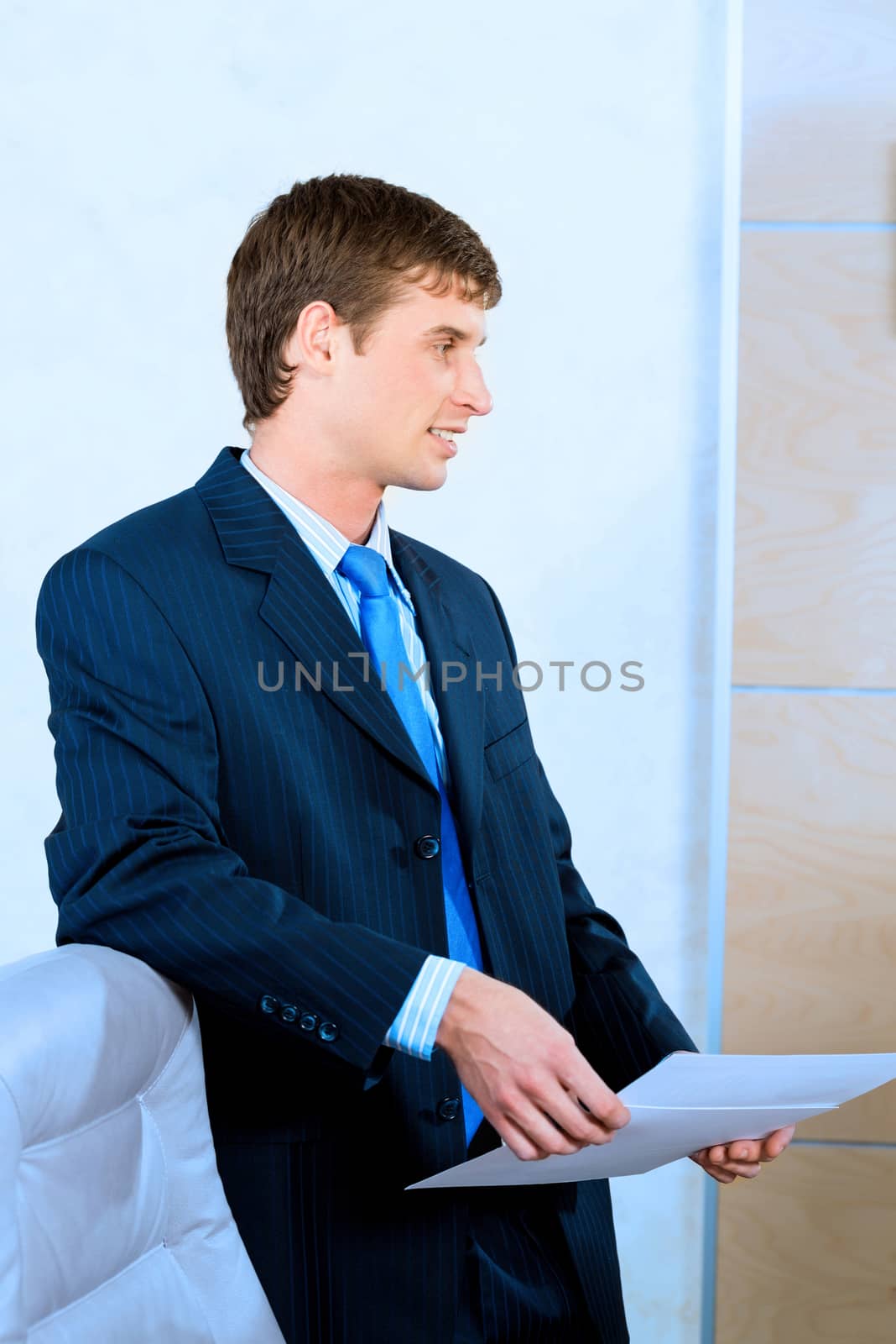 businessman in the office with business papers by adam121