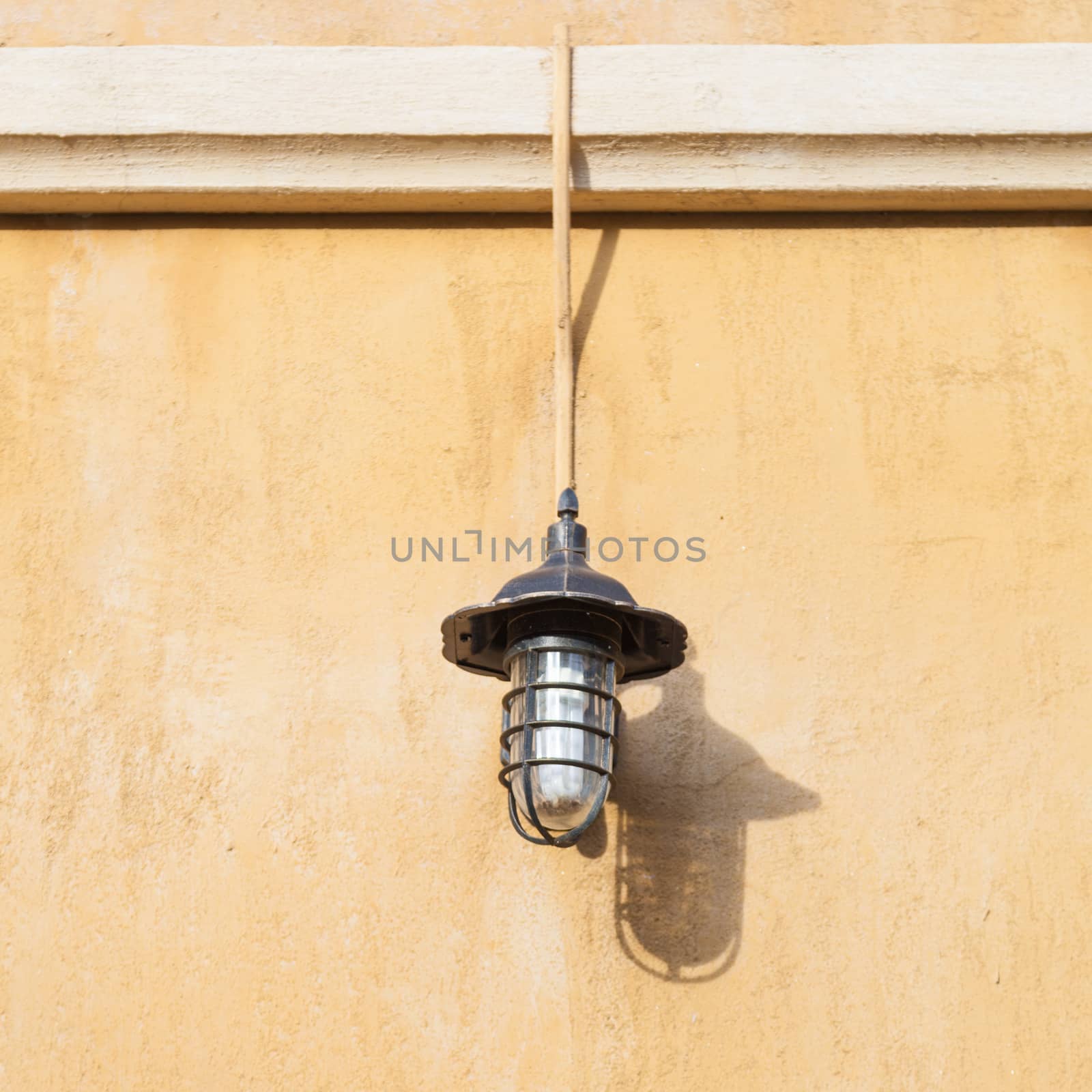 Lamp on the wall Russet walls Lanterns adorn a wall.