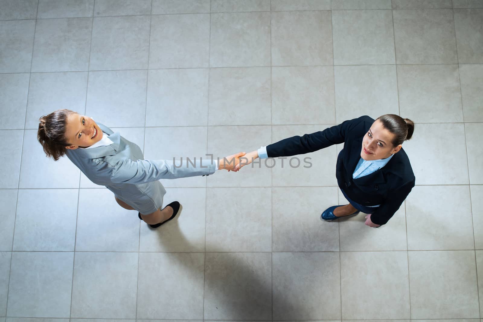 image of a business woman shaking hands, business meeting