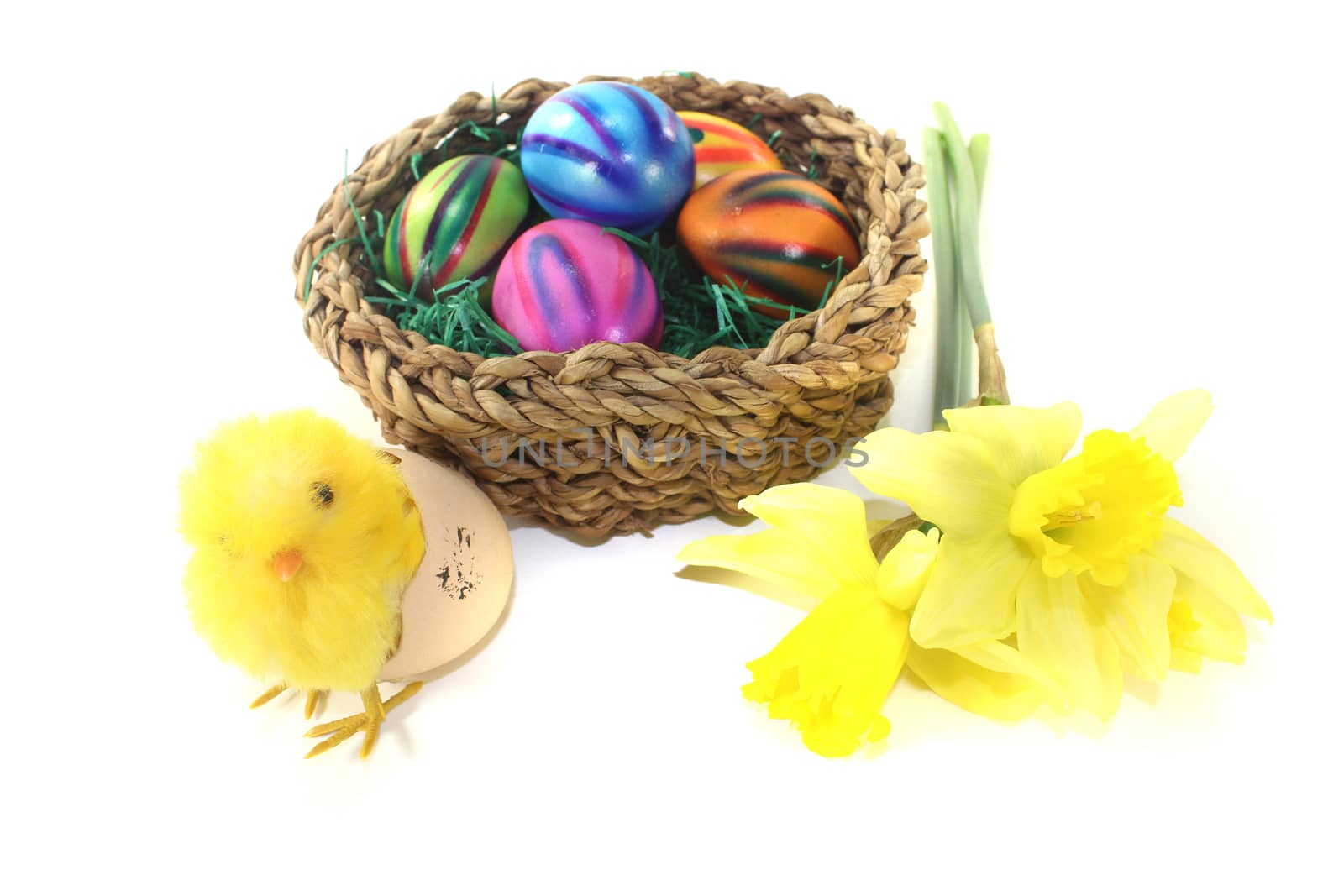 Easter Basket with chick and eggs on a light background