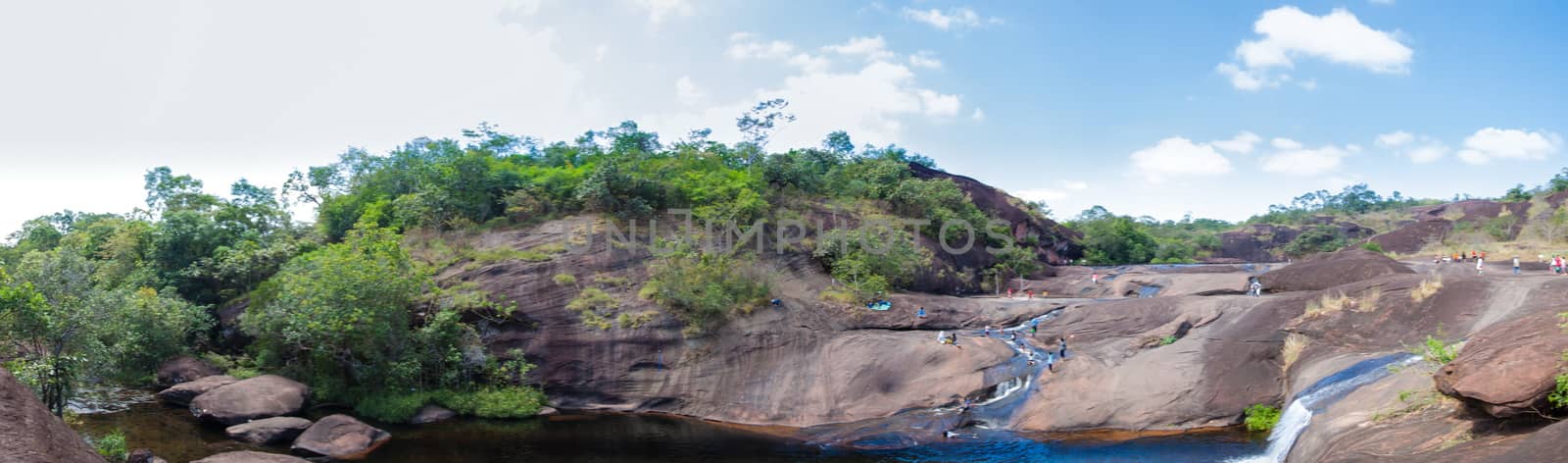 panorama waterfall that flows down from the mountains.large rock dropped from a high mountain.