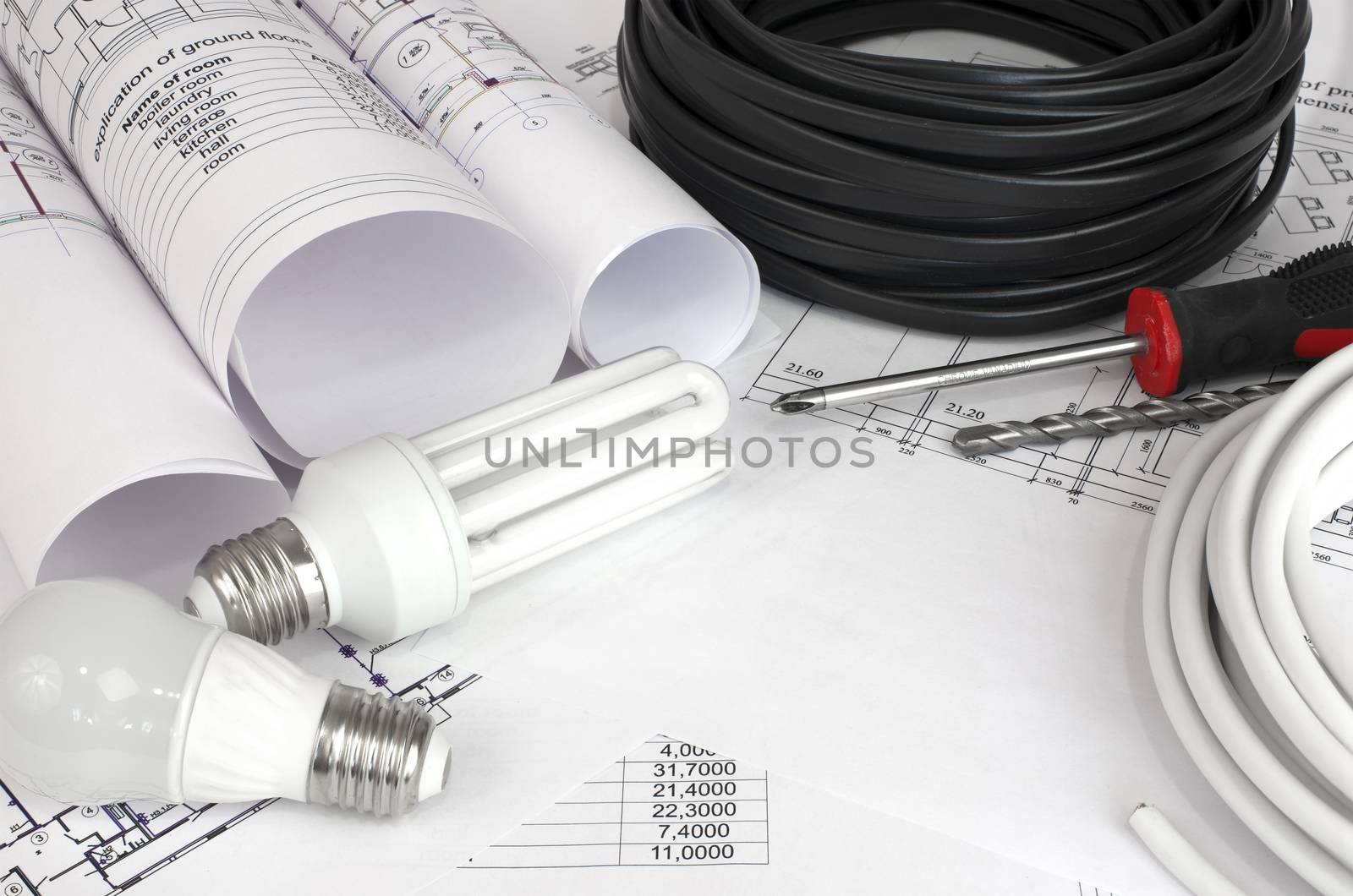 Electrical cable and bulbs on the construction drawings. Repair and construction of electric systems