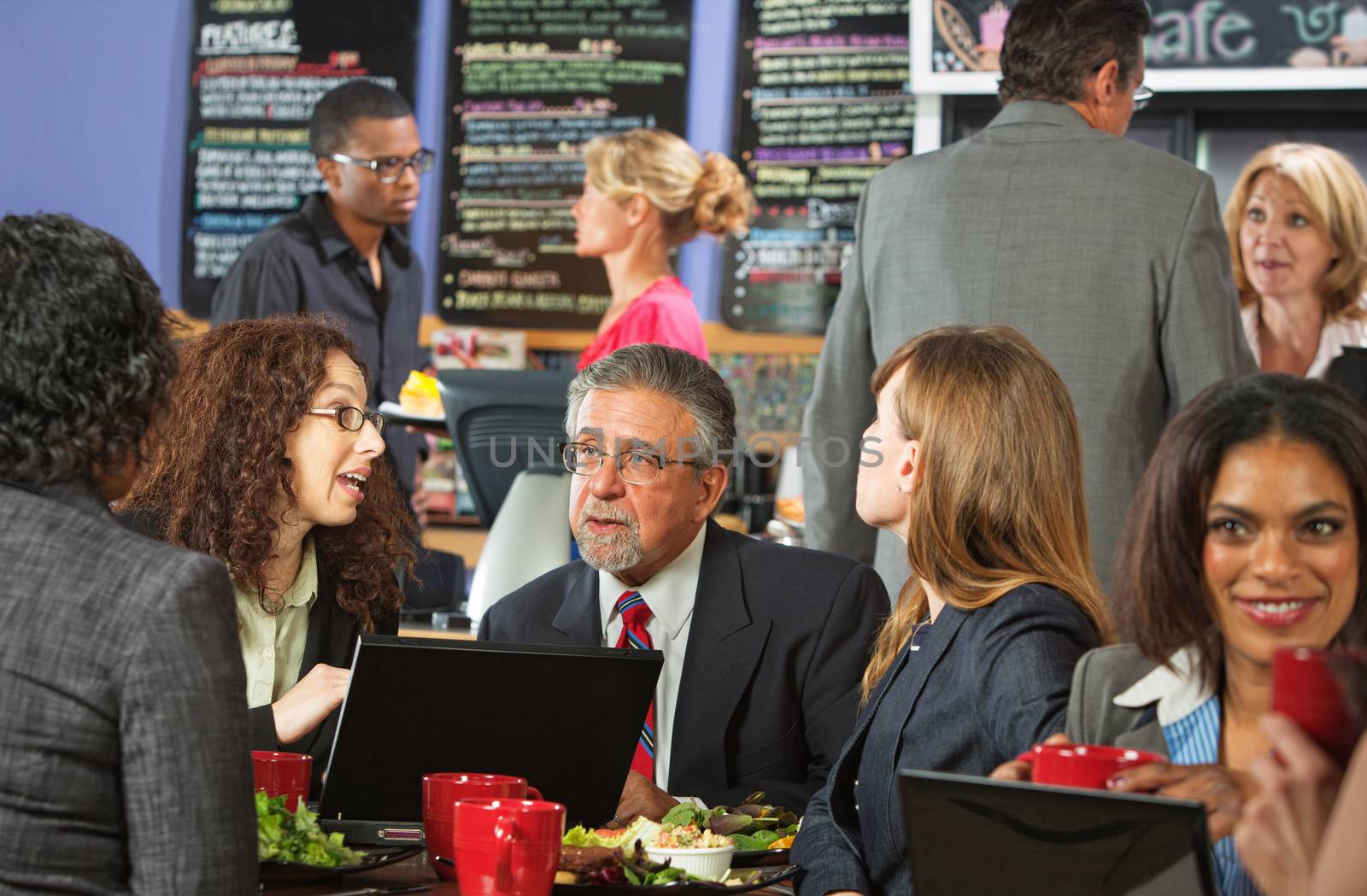 White collar workers with laptop in cafeteria