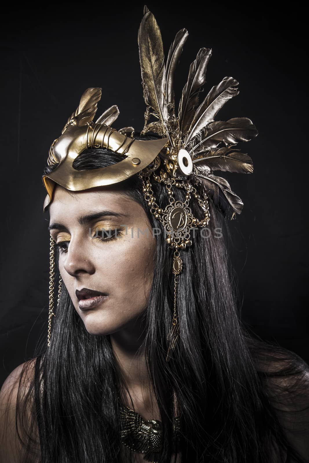 Cosmetic, ensual young woman with golden mask jewelry by FernandoCortes