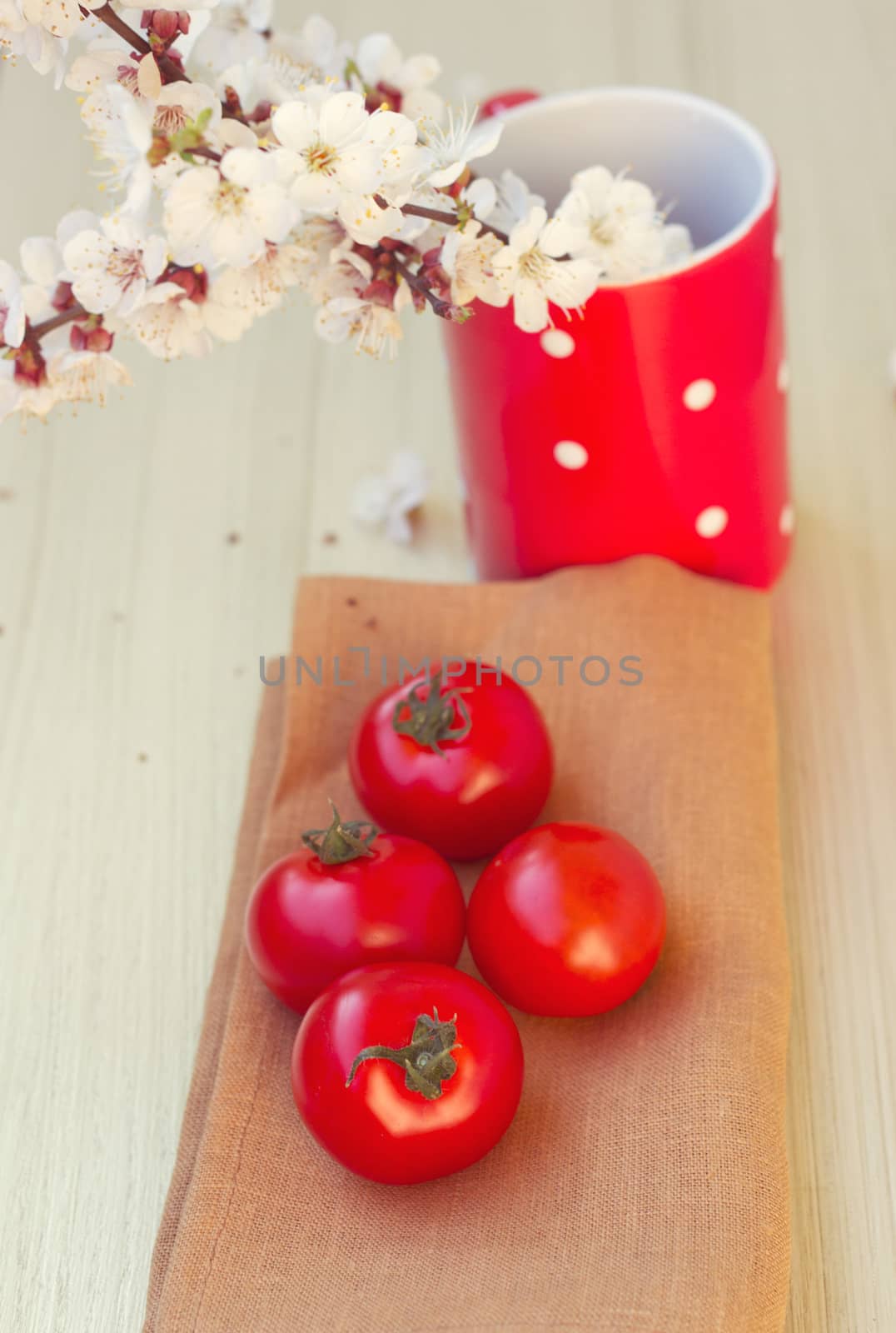 Fresh tomatoes on a wooden table top