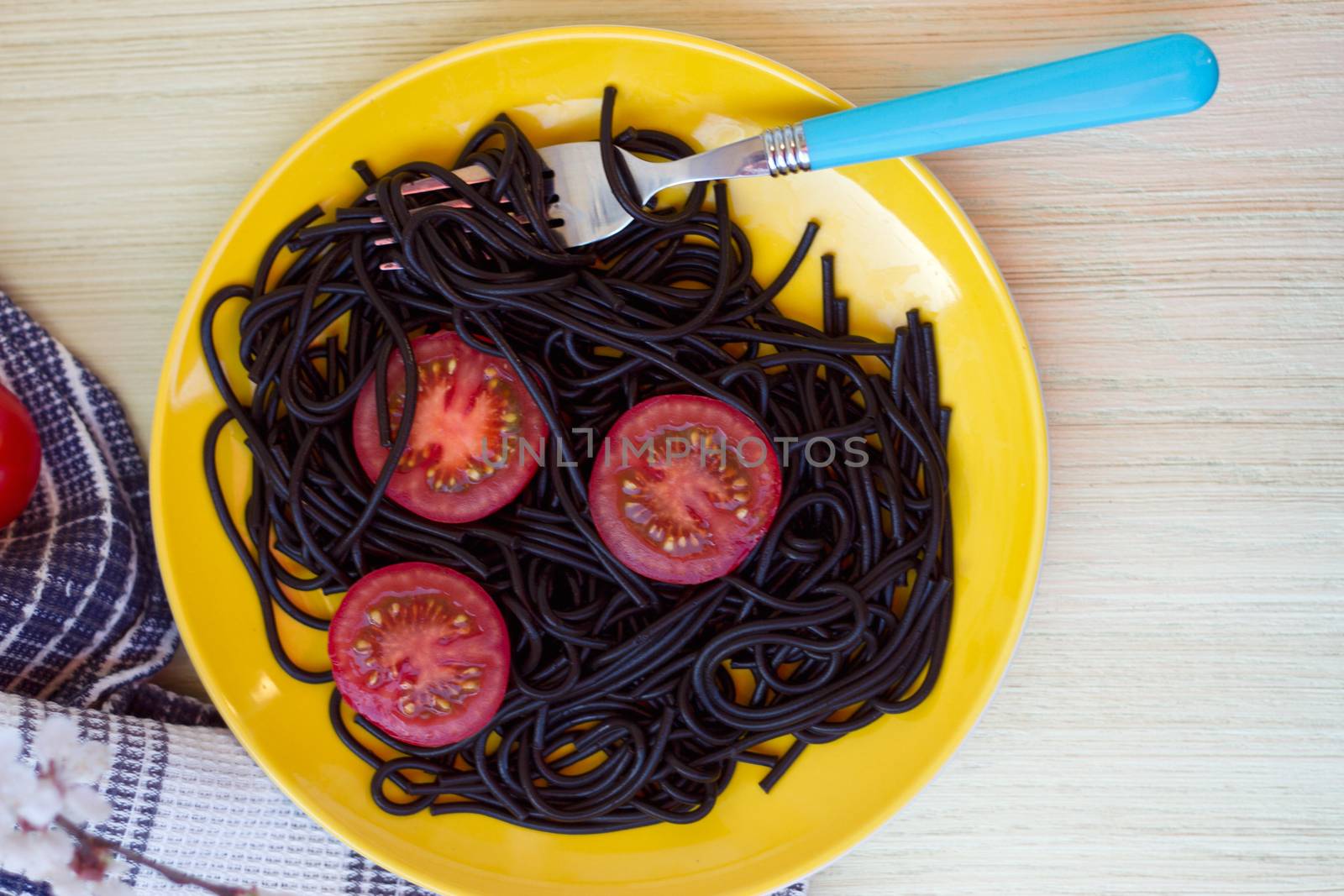 black pasta  with tomatoes sauce and shrimp