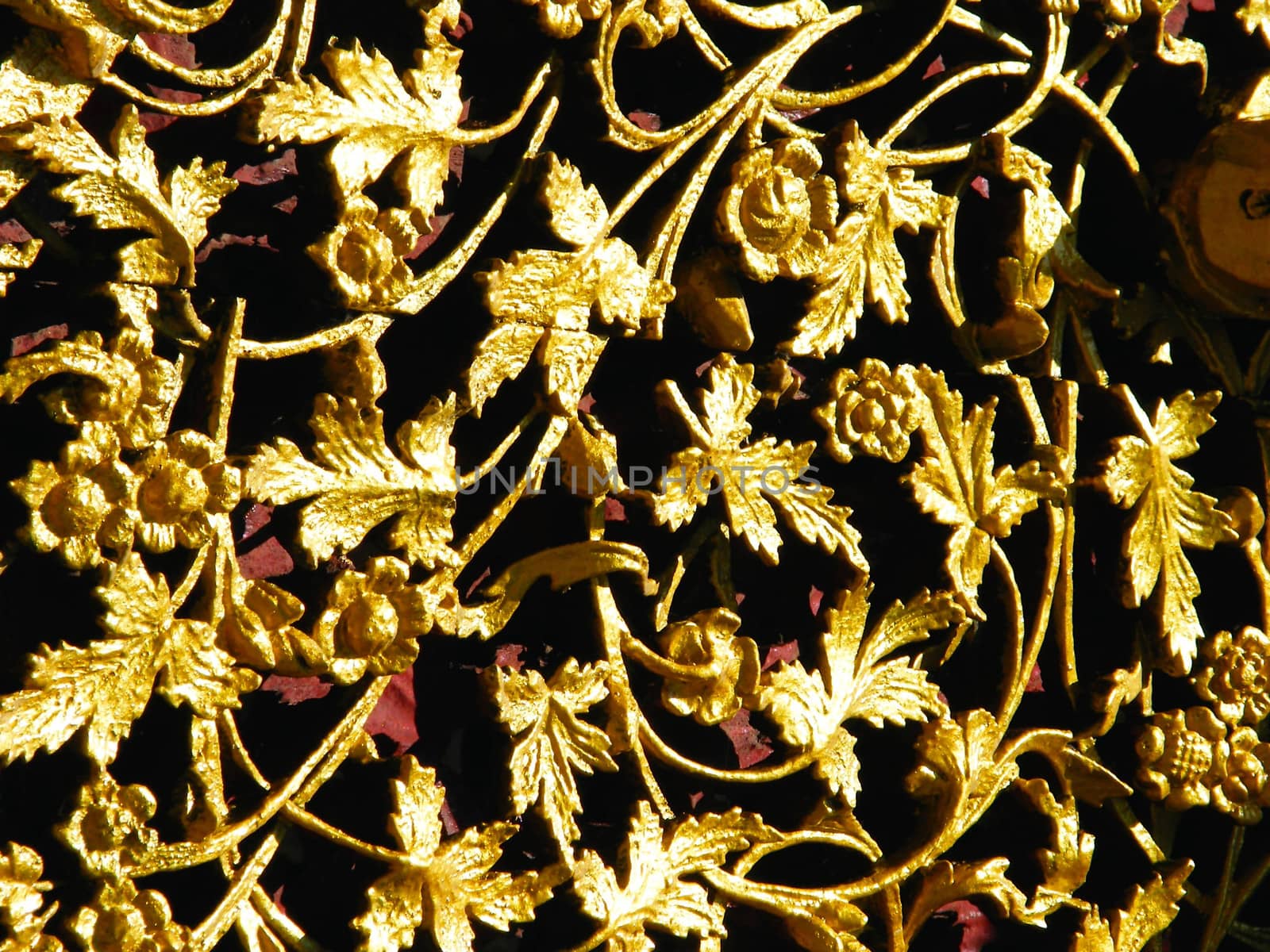 the complicated detail of wooden gate entrance at Wat Sri Chum,Lampang,Thailand