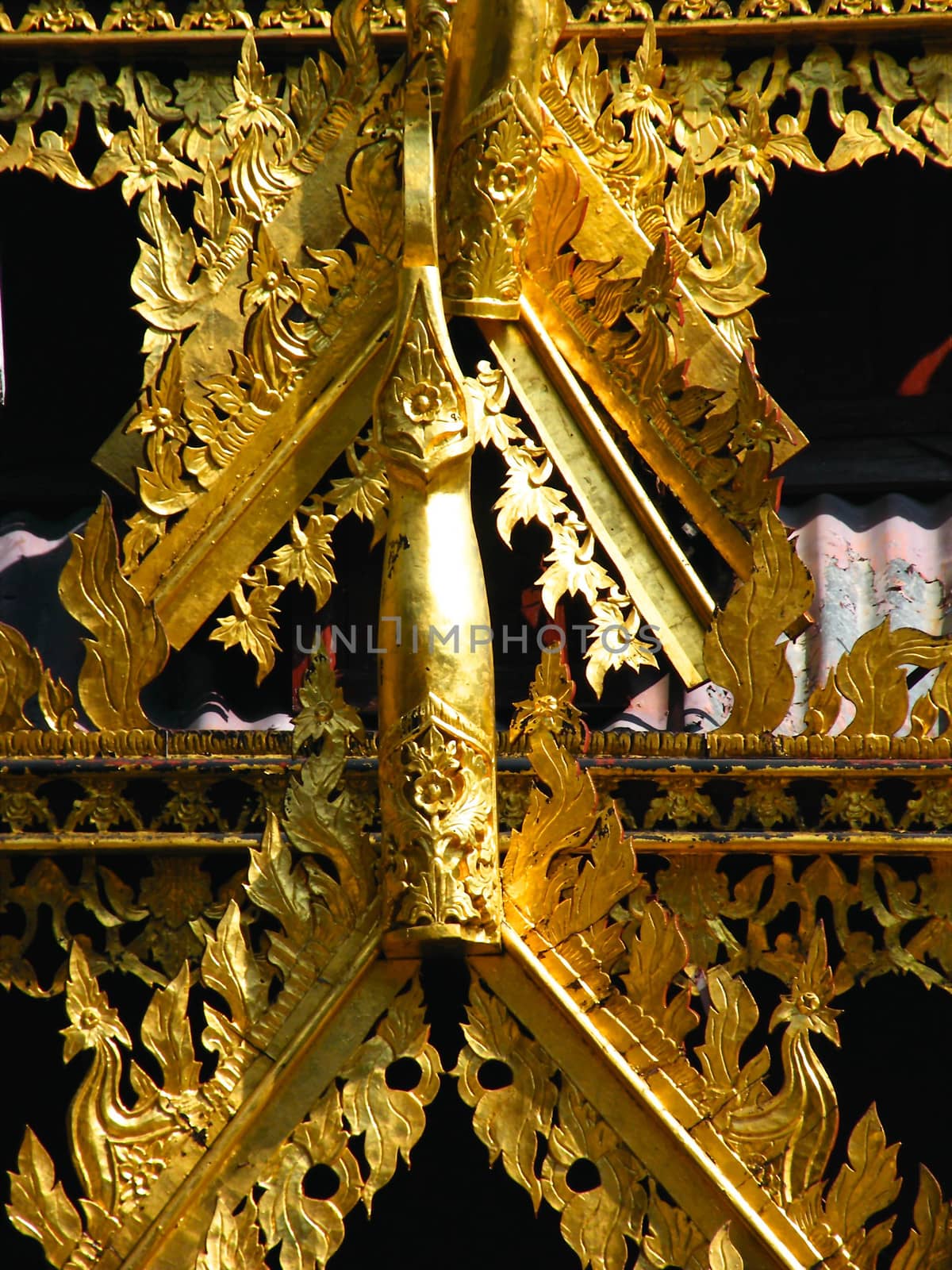 the complicated detail of wooden gate entrance at Wat Sri Chum,Lampang,Thailand