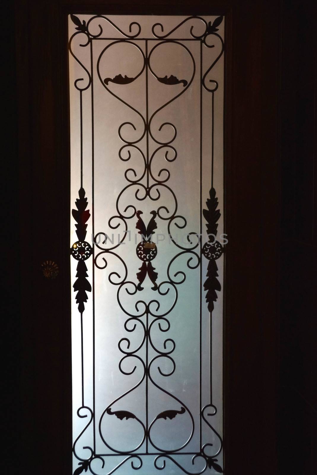 silhouette shadow against the glass door