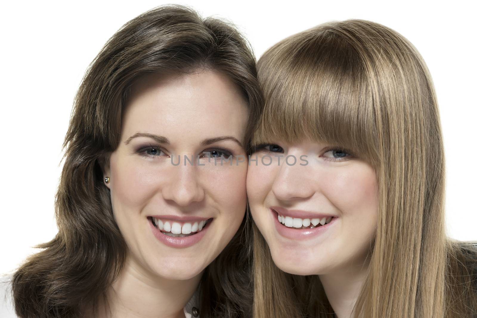 Portrait of two happy women, blond and brunette, isolated on white background