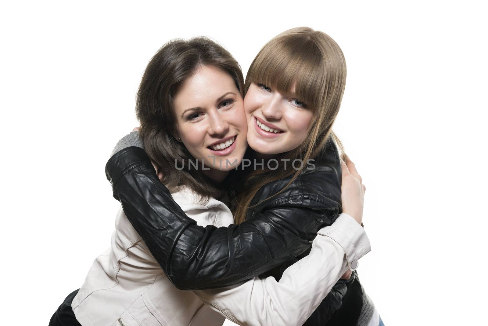 Portrait of two happy woman, blond and brunette, with black and white leather jacket, isolated on white background