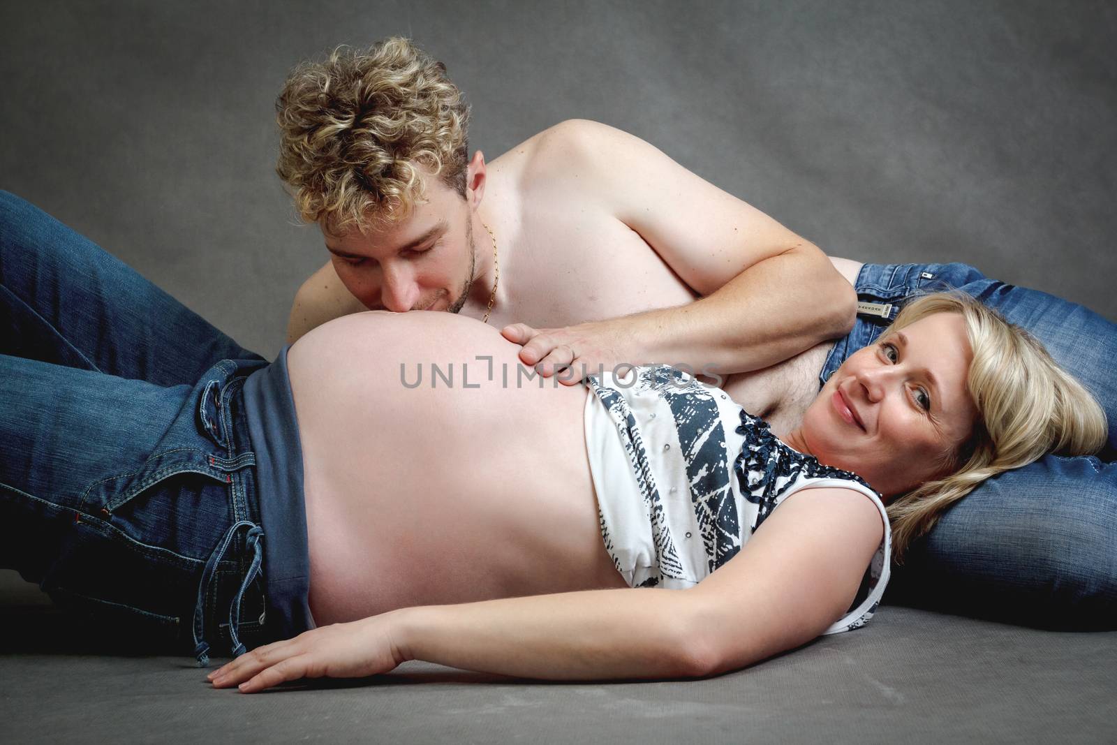 Loving happy couple, pregnant woman with her husband by artush
