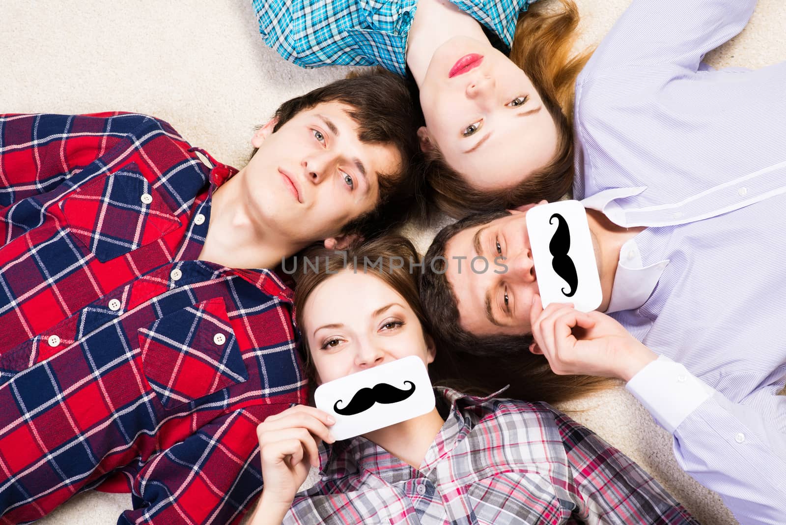 four young men lie together, applied to the face plate with a mustache