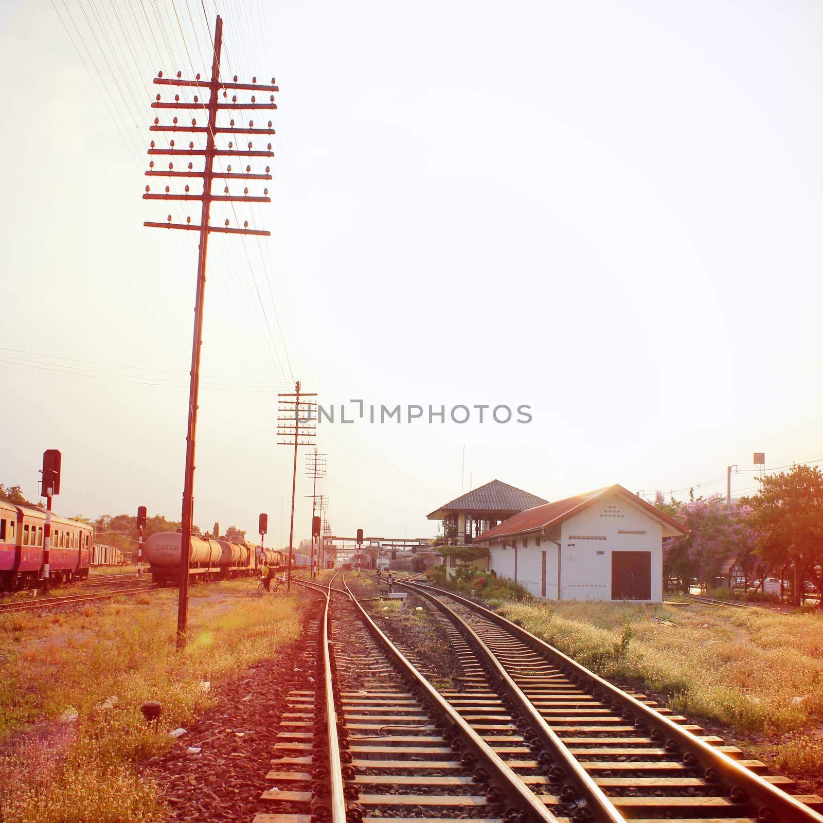 Old railway station with retro filter effect by nuchylee