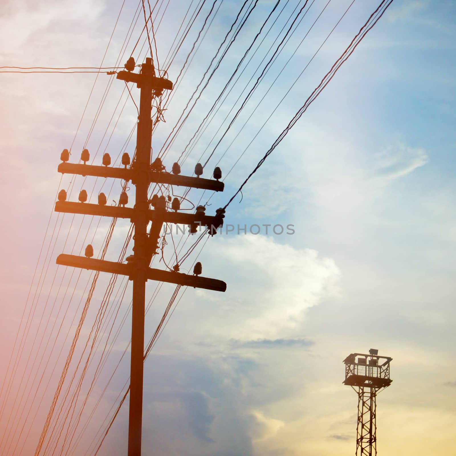 Silhouette of a street lamp and sky with retro filter effect by nuchylee