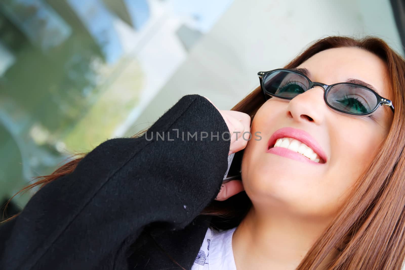 A business woman talking on the cell phone.