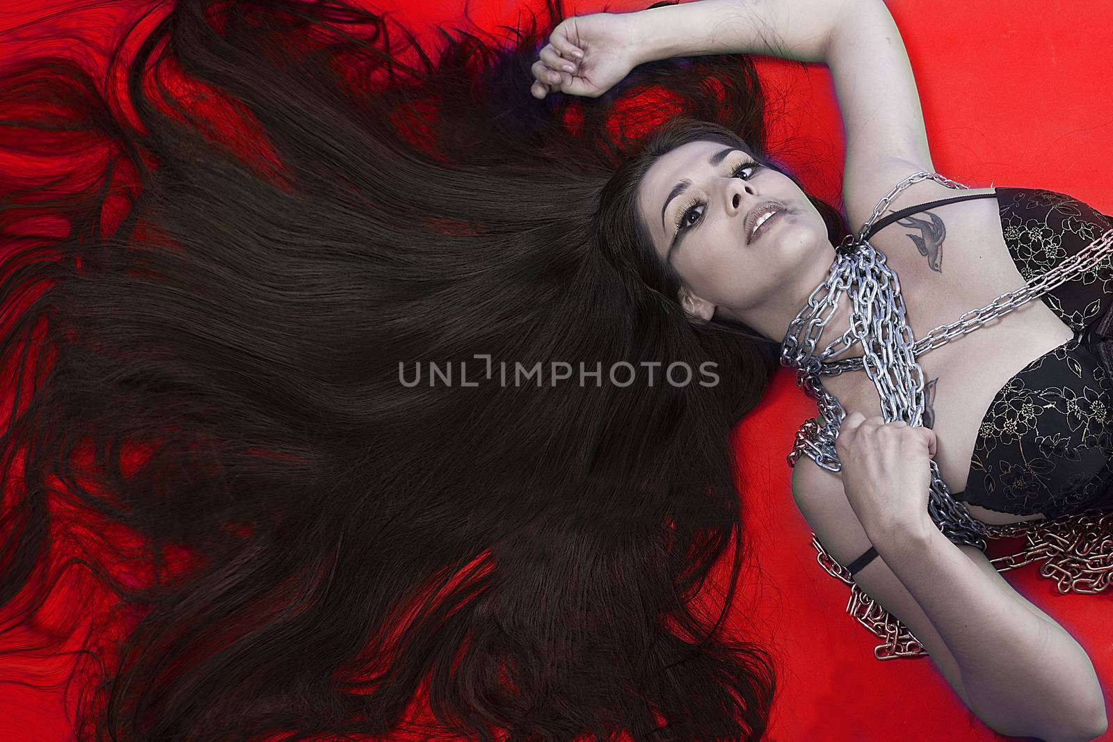 Red. Beautiful brunette woman with silver chains in her body by FernandoCortes