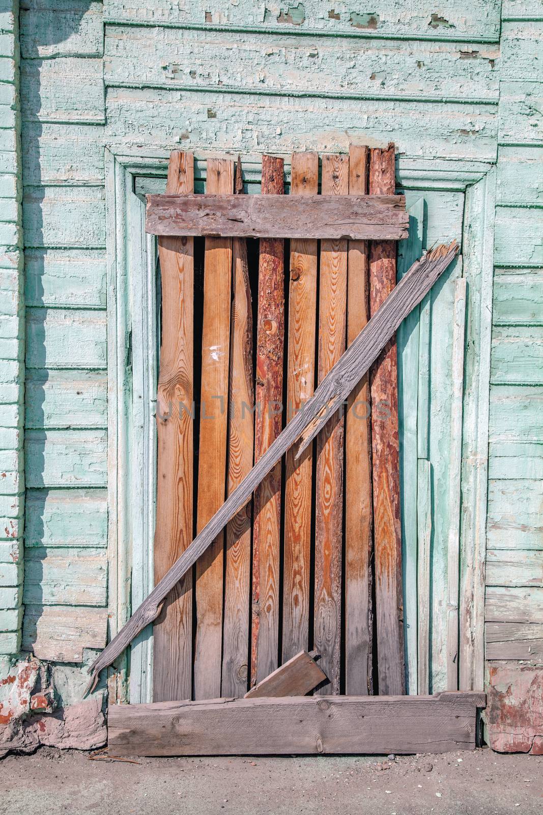 Old decayed wooden door by anelina