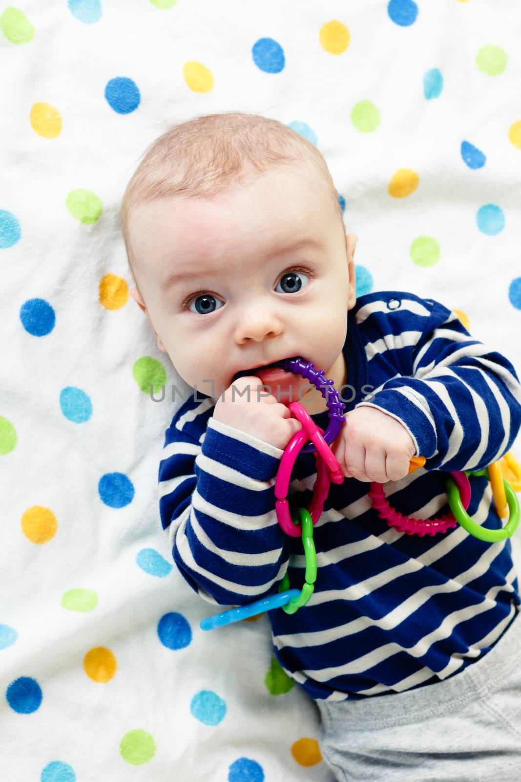 Funny cute blue-eyed baby. Little boy astonished