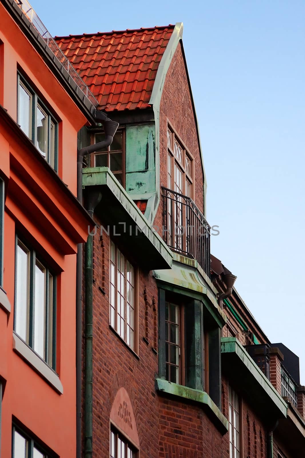 Brick building with balcony by Stavrida