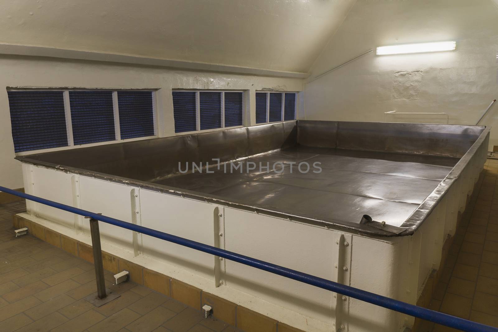 Open fermenter at Brewery Van Honsebrouck in Belgium. Open fermenters harvest will yeast from the air, the ancient way to ferment sugary liquids.