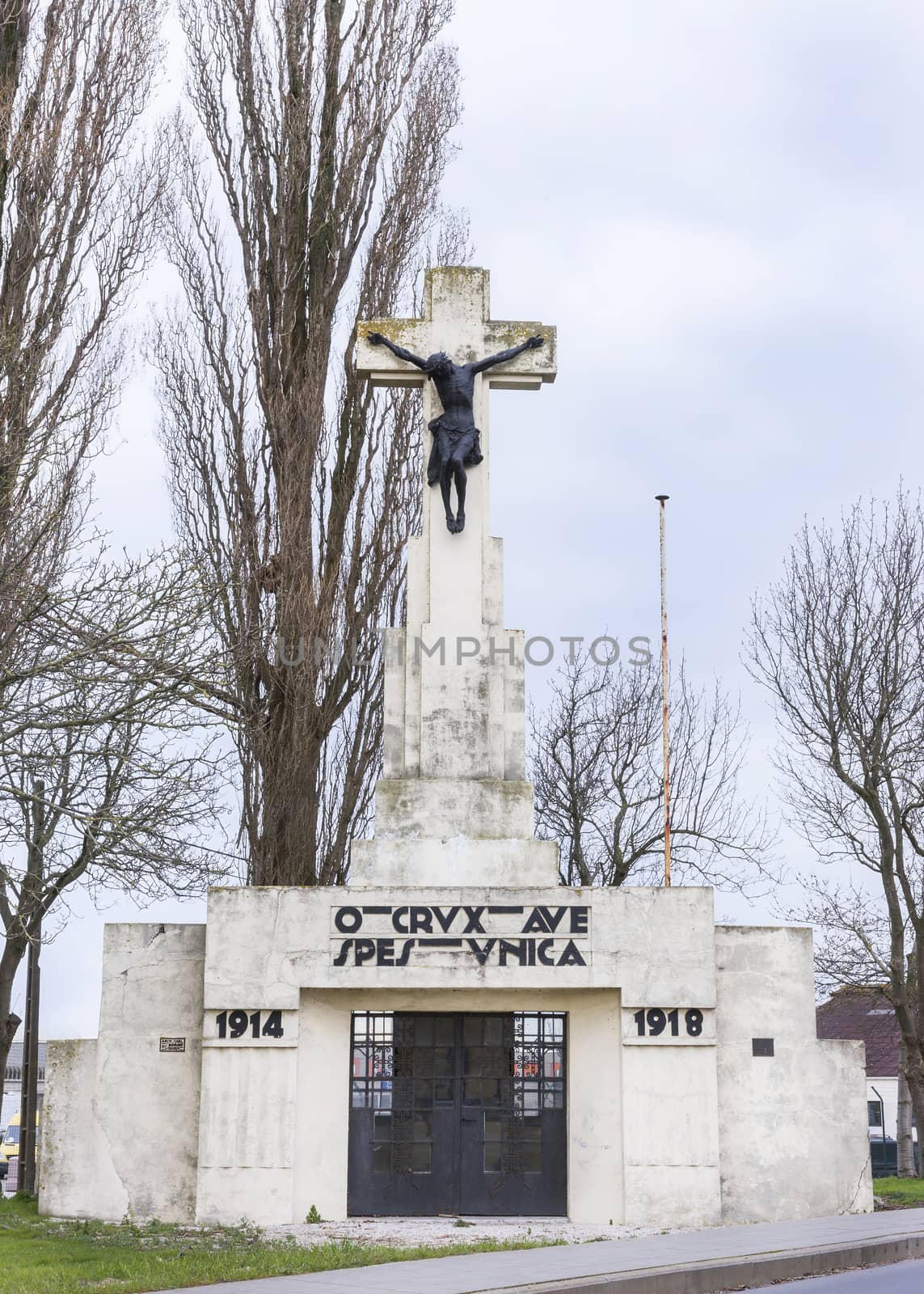 Calvary statue as World War I memorial in Diksmuide, near Ypres along the Yser River. The Latin texts reads "Hail to the cross, our only hope."