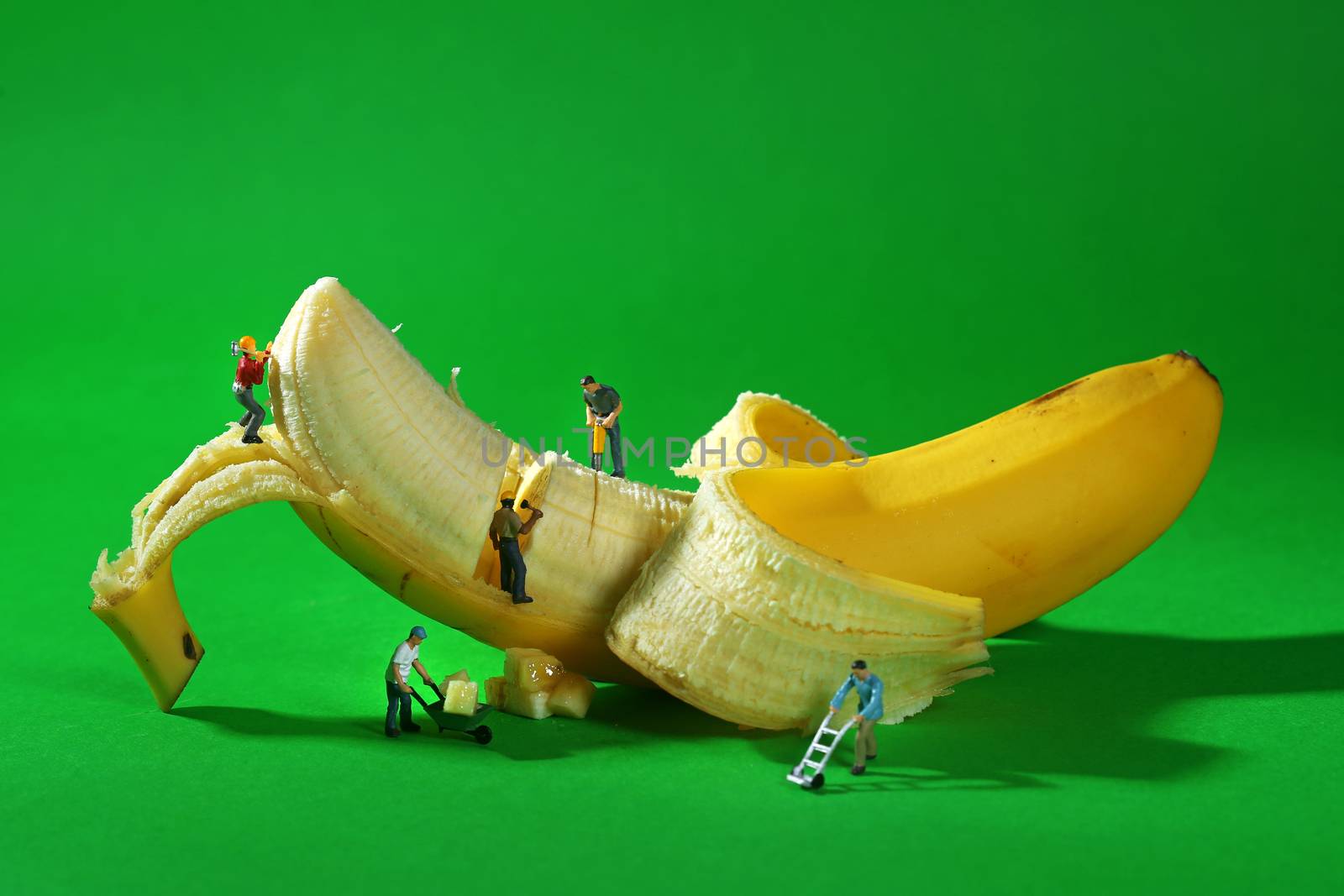 Construction Workers in Conceptual Food Imagery With Banana by tobkatrina