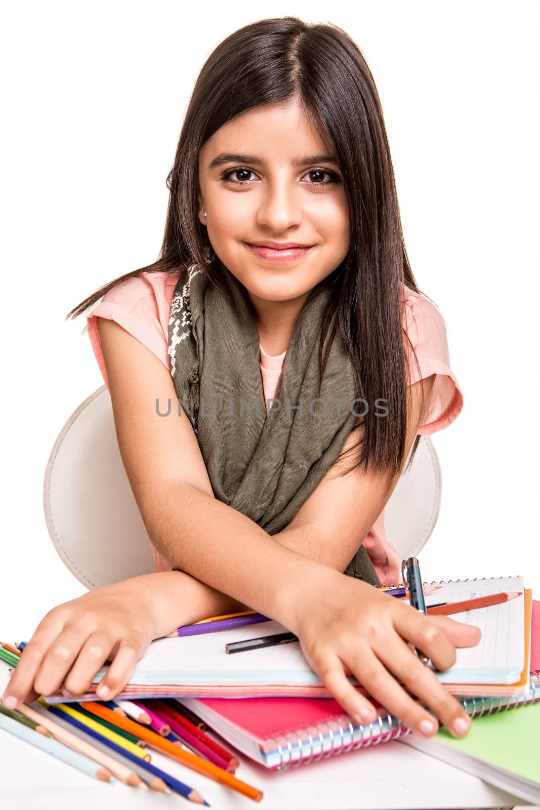 Cute little girl drawing with colorful pencils