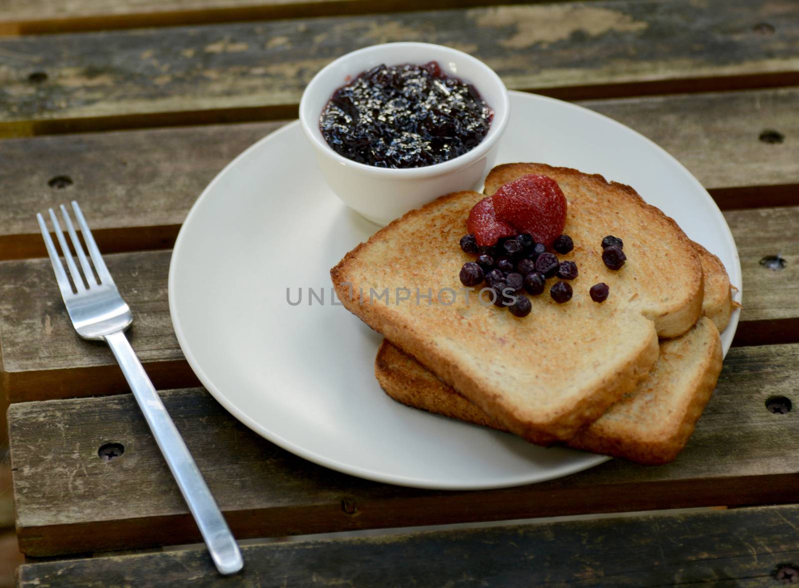 berry toast breakfast on wood
