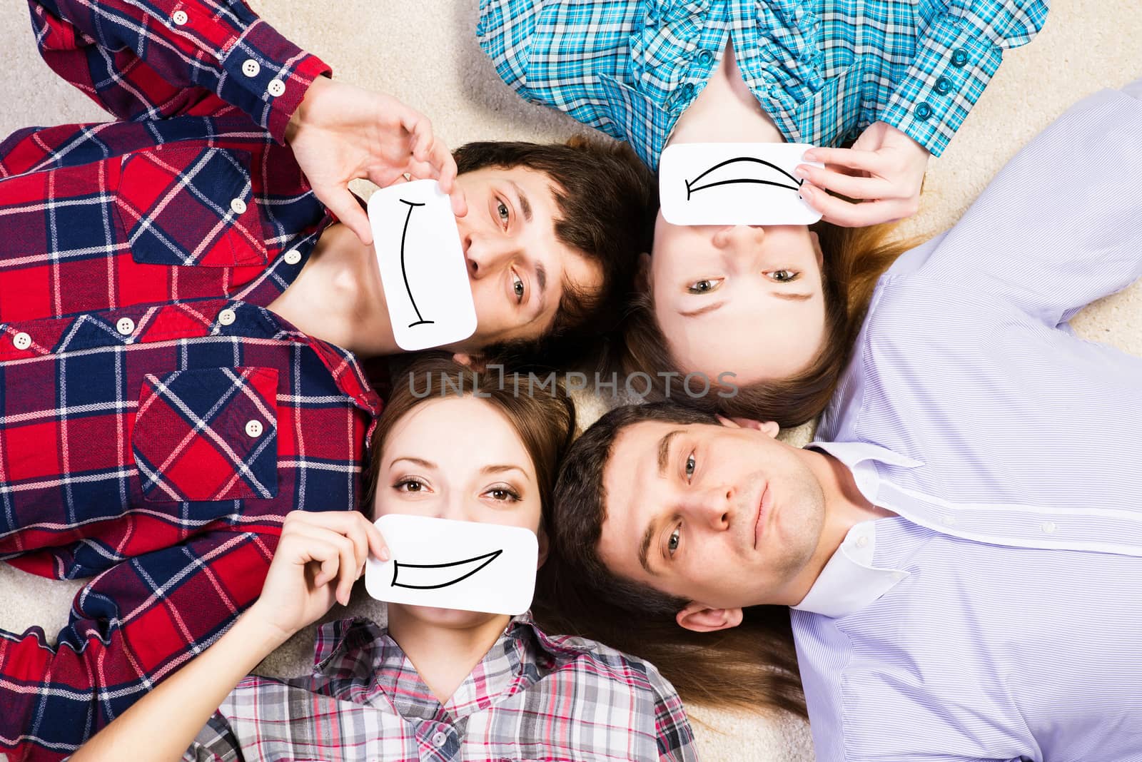 four young men lie together, applied to the face card with smiles