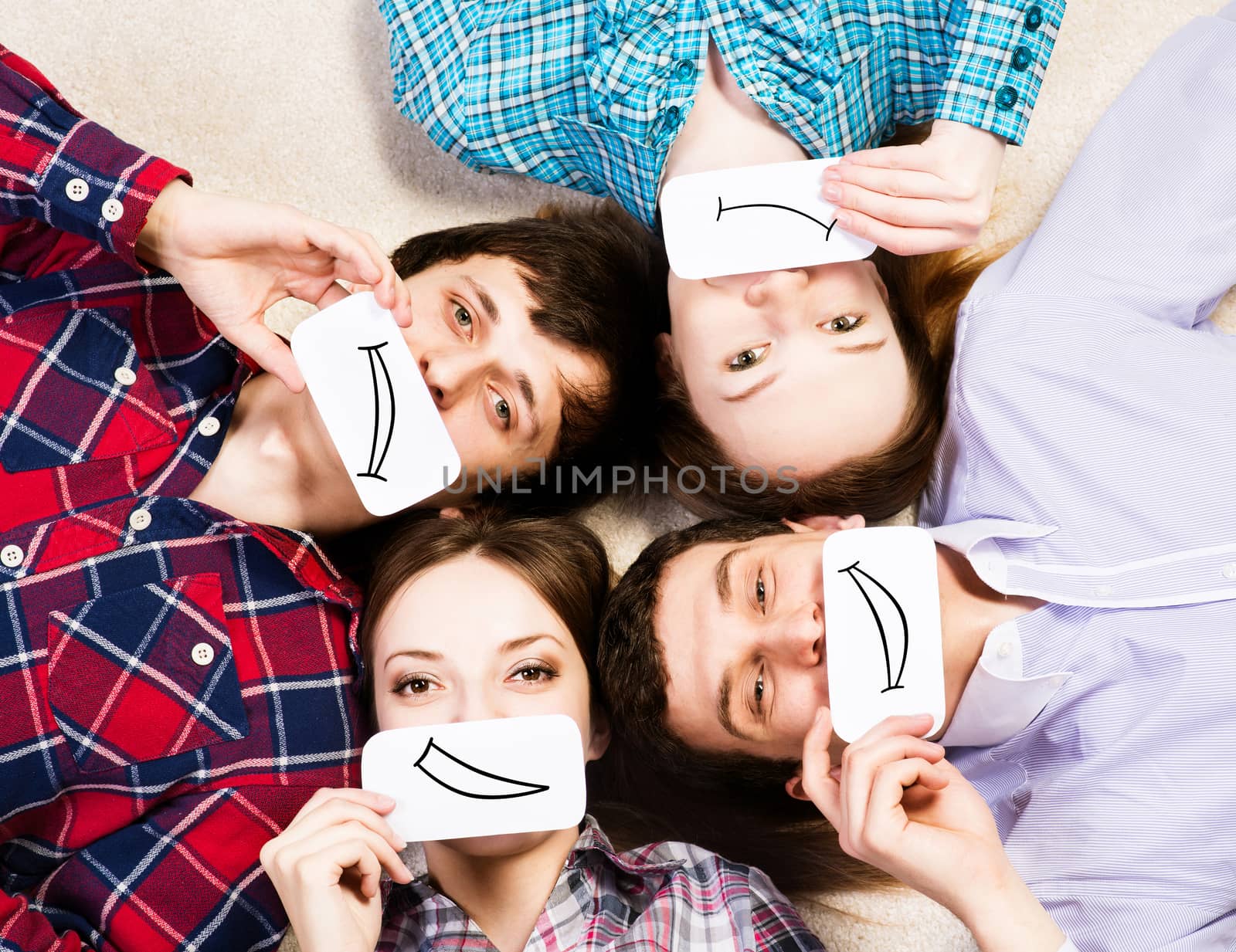 four young men lie together, applied to the face card with smiles